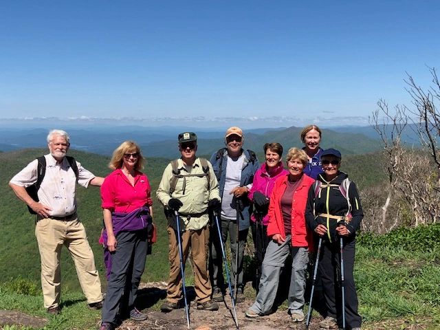 Group hikers mountain ridge overlook